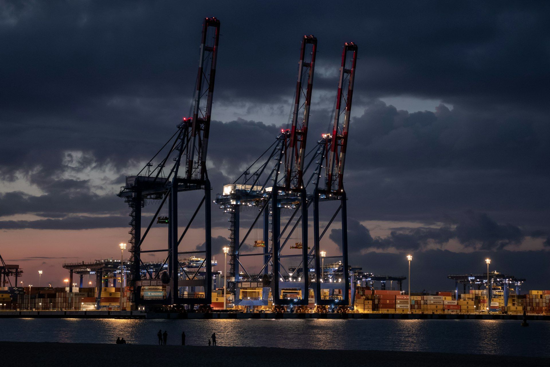 Container cranes at the port of Gdańsk at dusk