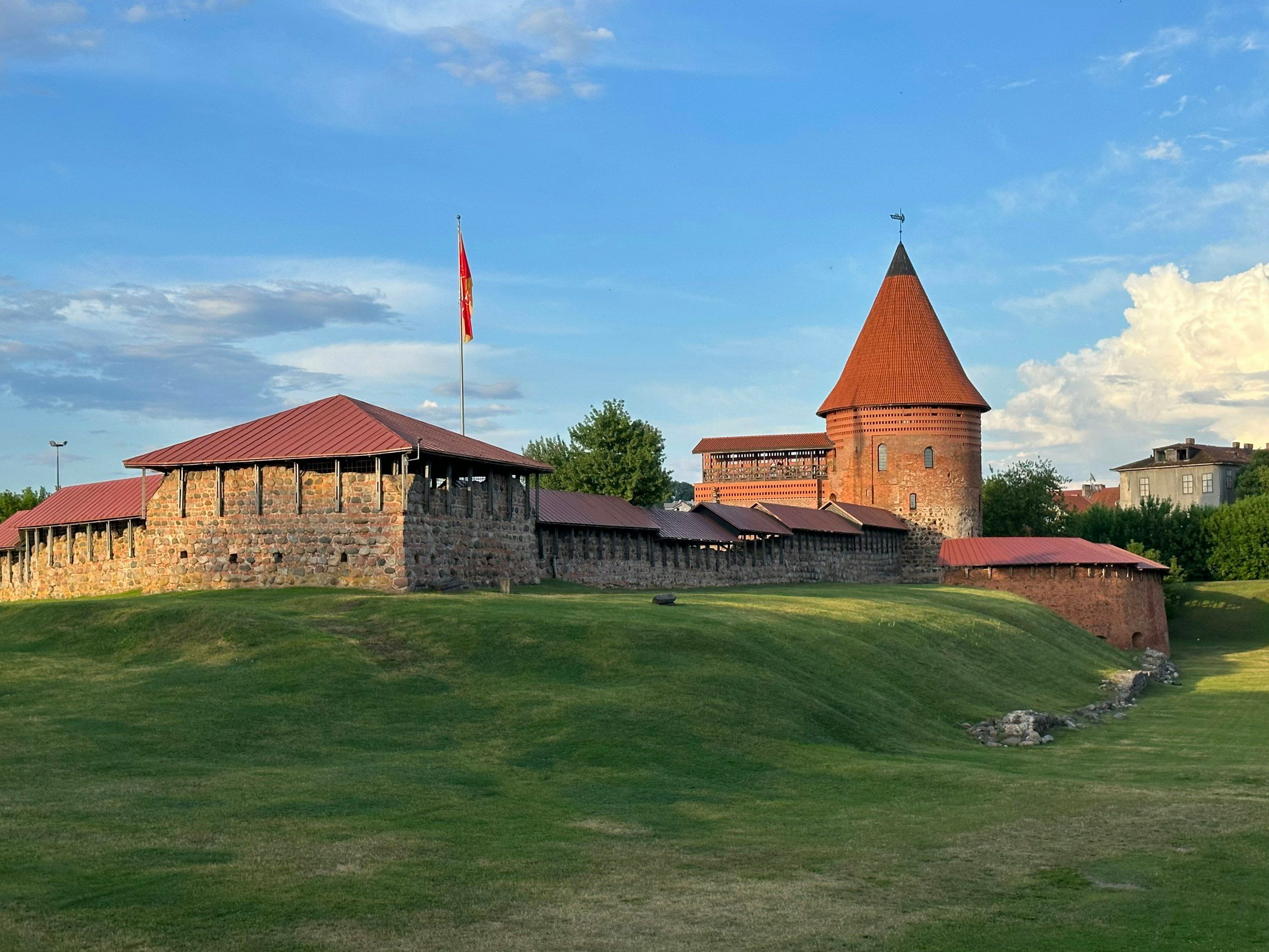Kaunas Castle, near where the Nemunas and Neris rivers meet, in evening sunlight