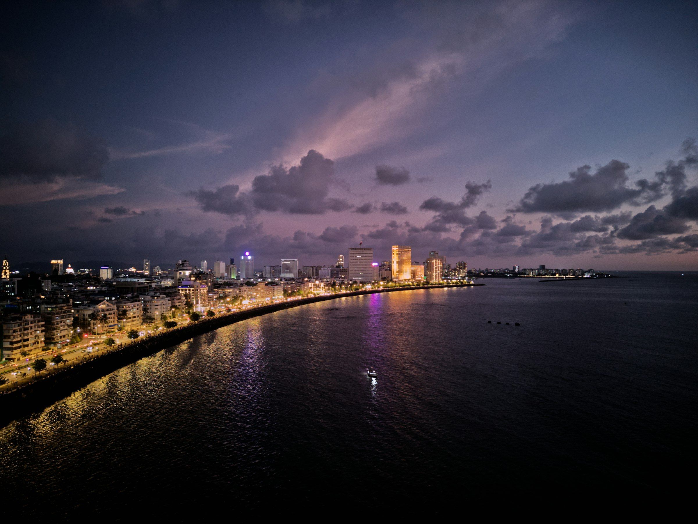 Marine Drive and the Mumbai skyline along the Arabian Sea at dusk
